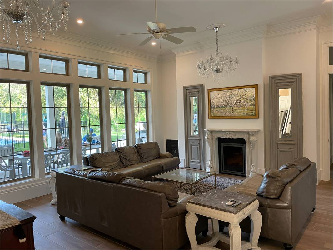 Client Photo of Family Room with Double Chandeliers